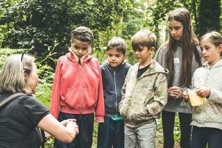 Children taking part in a woodland walk at the Goodwood Education Trust